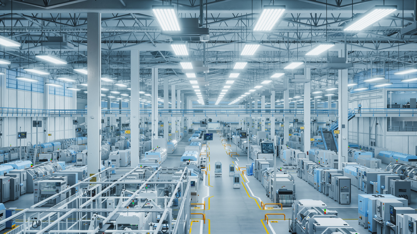 Modern Manufacturing Plant with Advanced Robotic Arms Operating on an Assembly Line with Electronic Components Moving on Conveyor Belts. Elevated Top Angle Shot Of Advanced Facility.